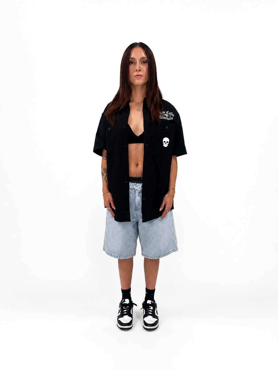 Blue Collar Criminals model in skull shirt and jean shorts